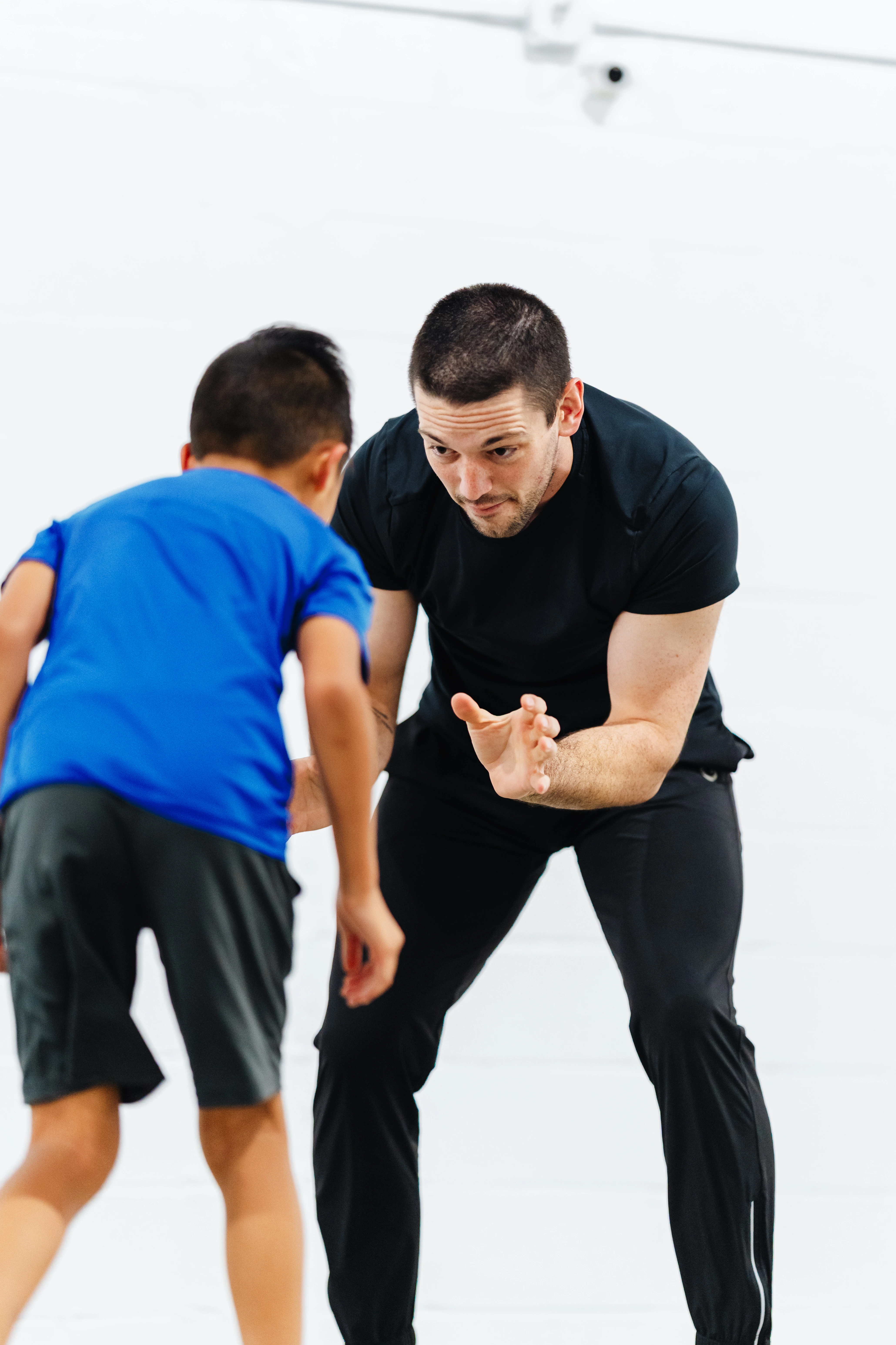 Haven Grappling coach working with a young student